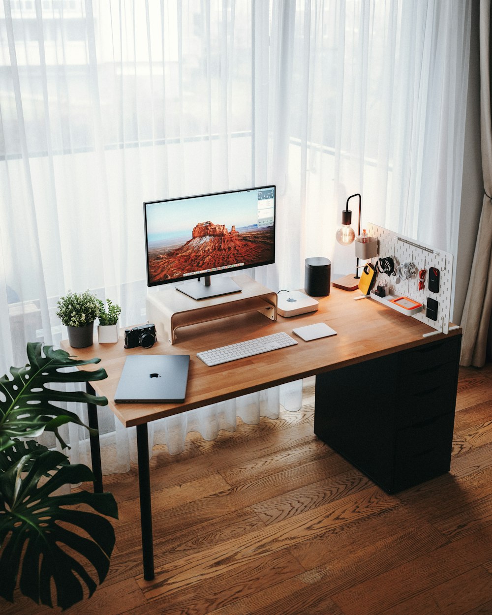 a wooden desk with a computer on top of it