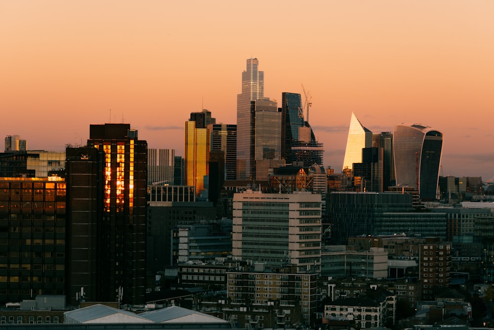 a view of a city skyline at sunset