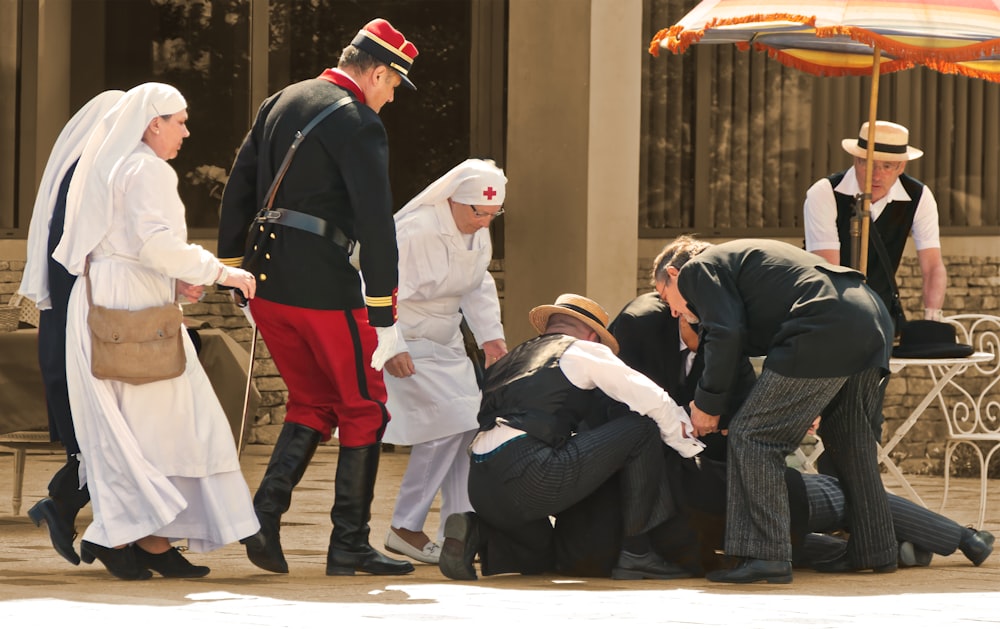 a group of people standing around each other