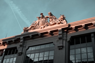 A building with a statue on top of it