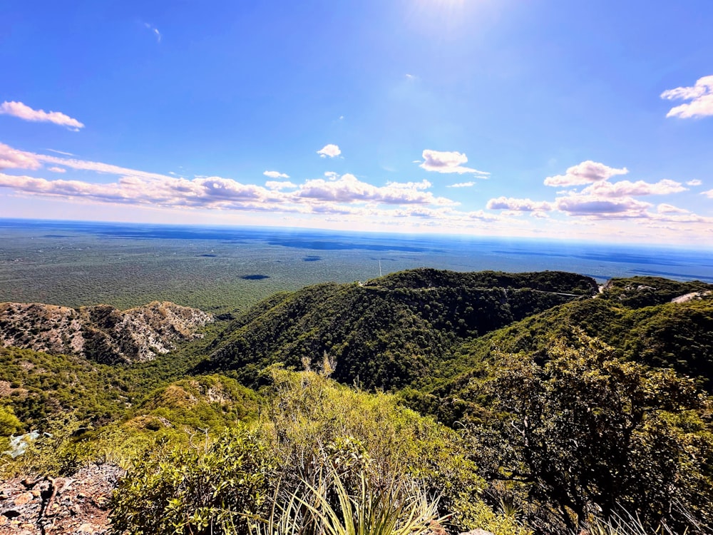 a scenic view of a valley and mountains