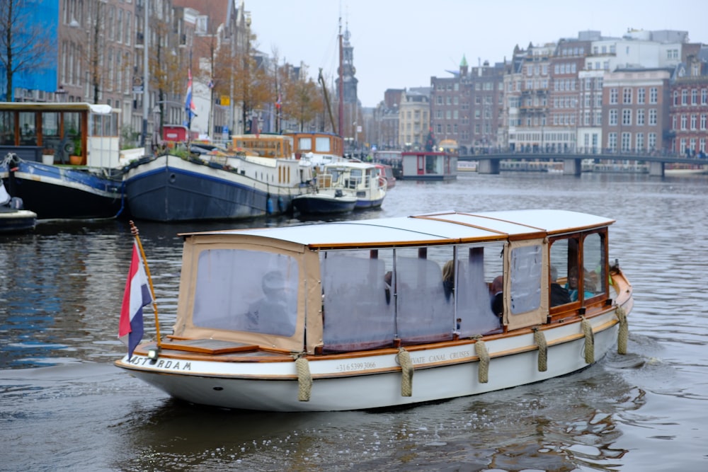 a small boat floating on top of a body of water