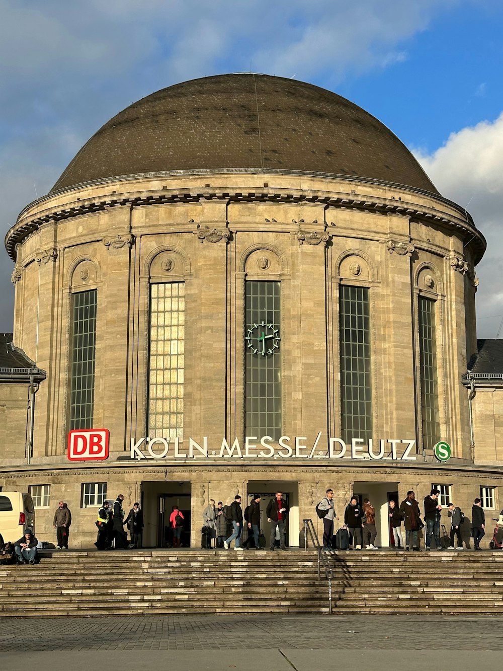 a group of people standing outside of a building