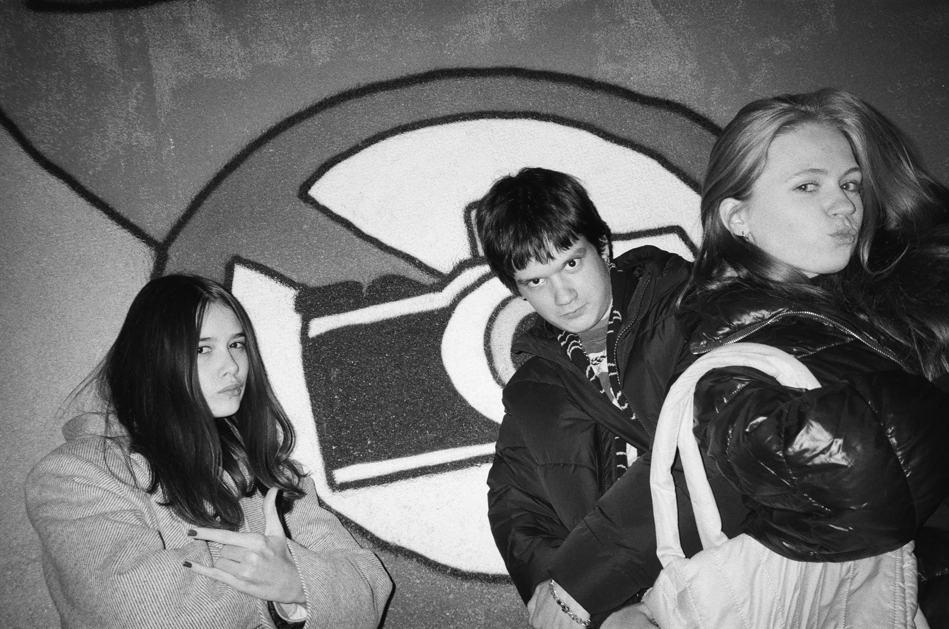 a group of young people standing next to each other