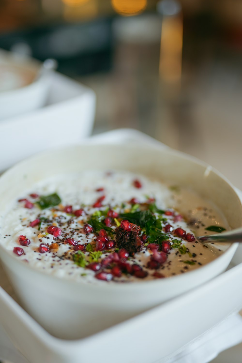 a bowl of soup with a spoon in it