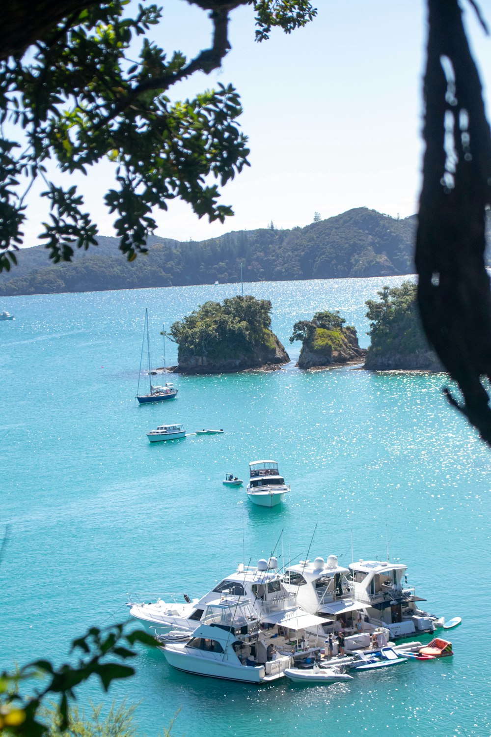 a group of boats floating on top of a body of water