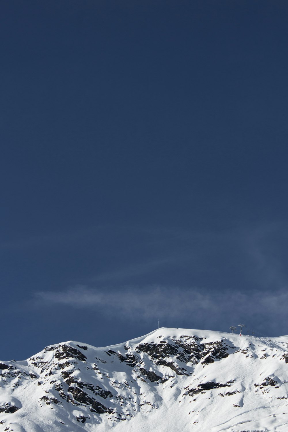 a person is skiing down a snowy mountain