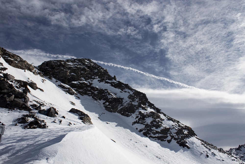 a person skiing down a snow covered mountain