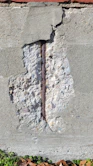 a brick wall with a crack in it