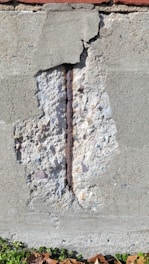 a brick wall with a crack in it