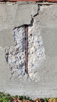 a brick wall with a crack in it