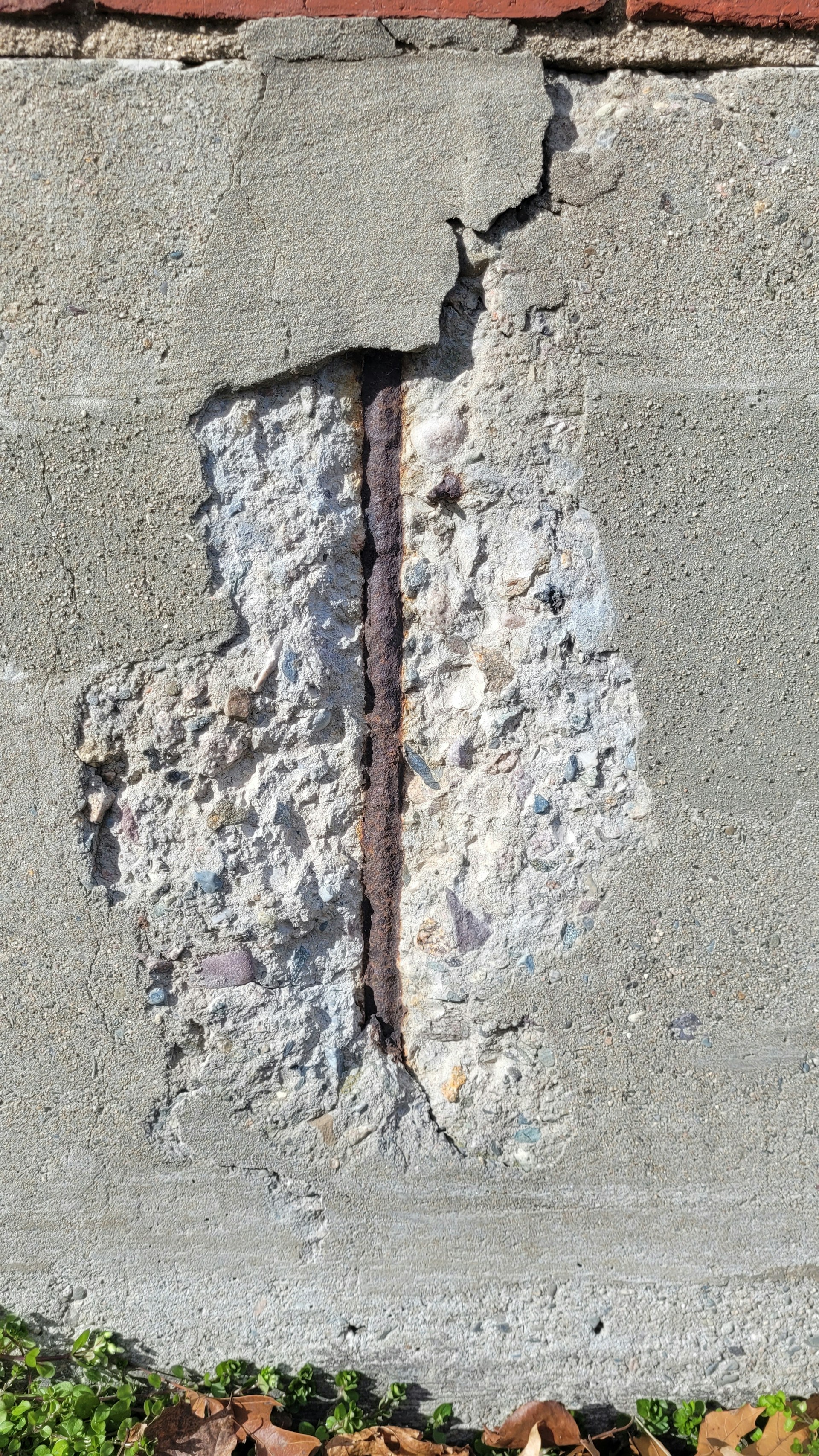 a brick wall with a crack in it