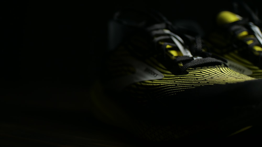 a close up of a pair of shoes in the dark