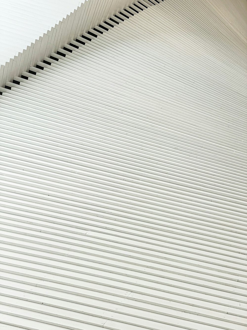 a close up of a white building with lines on it