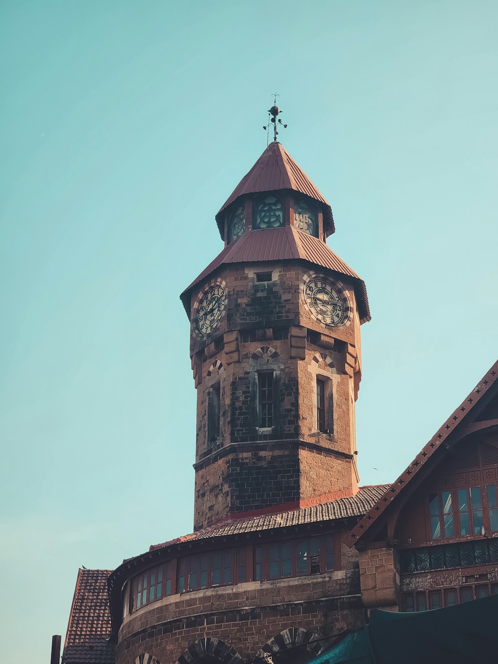 a tall tower with a clock on the top of it