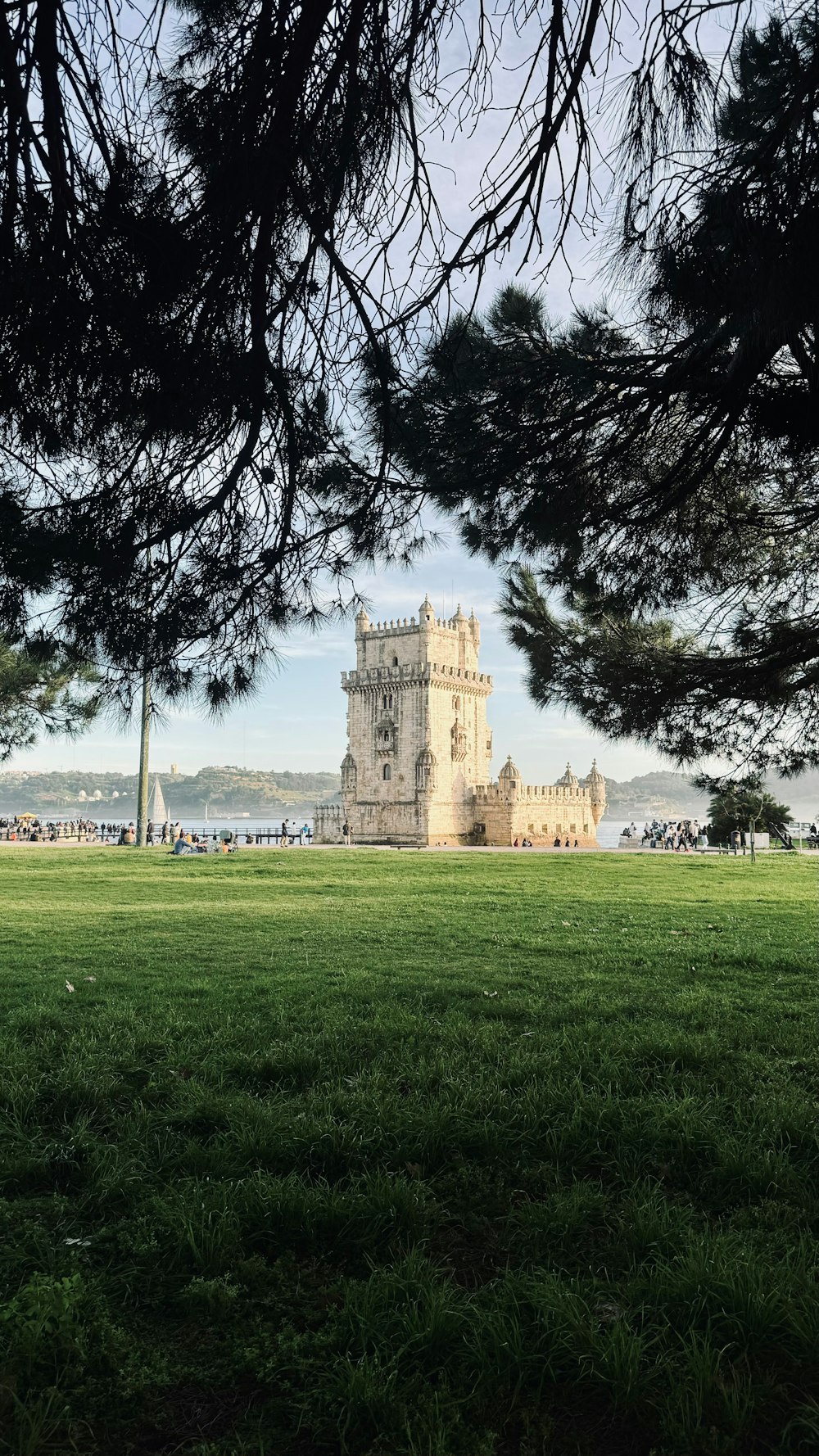 a view of a castle through some trees