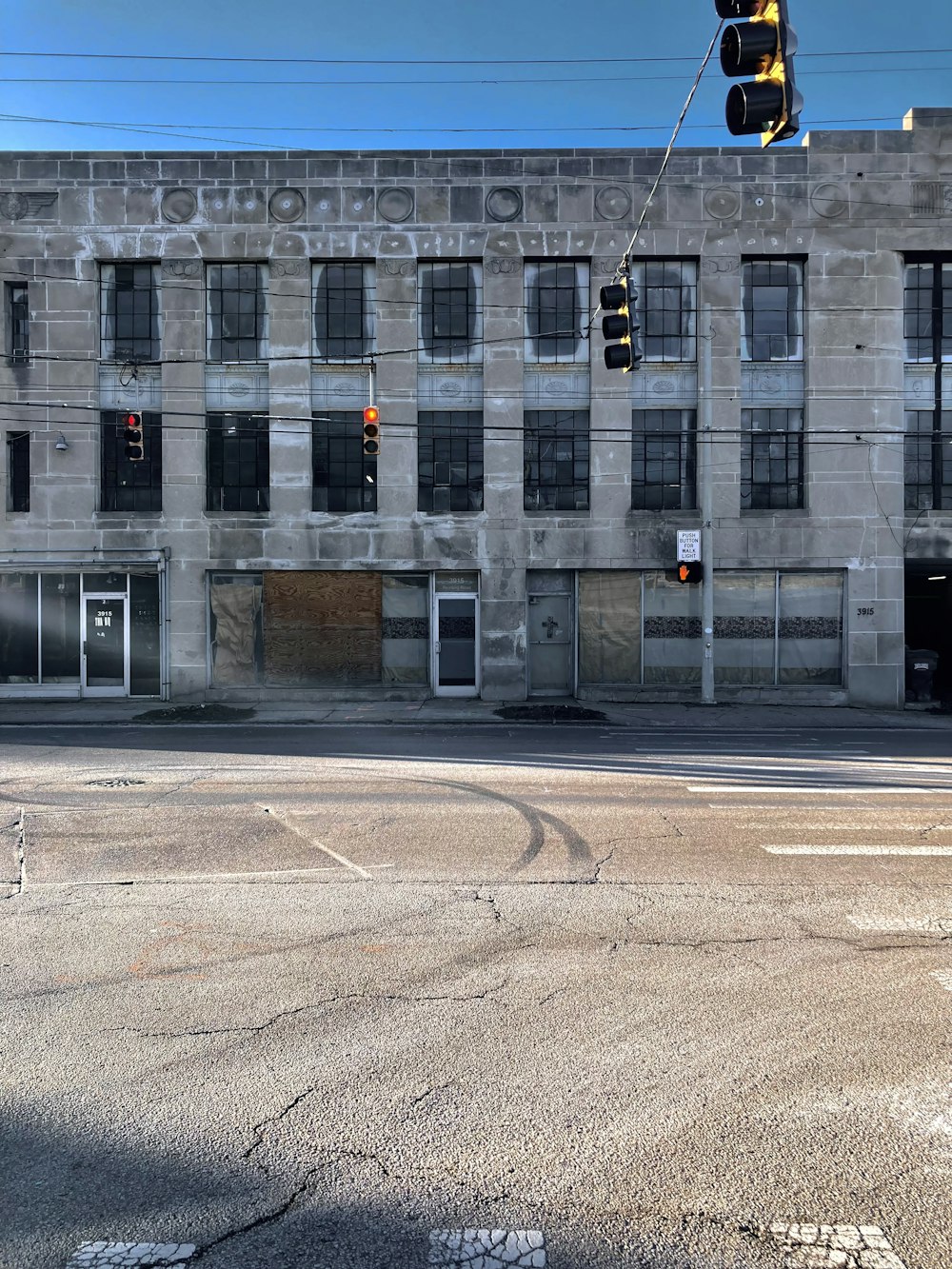 an empty street in front of an old building