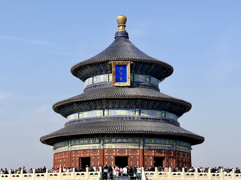 a tall building with a blue sky in the background