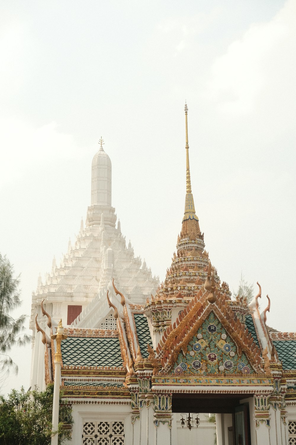 a large white building with a gold roof