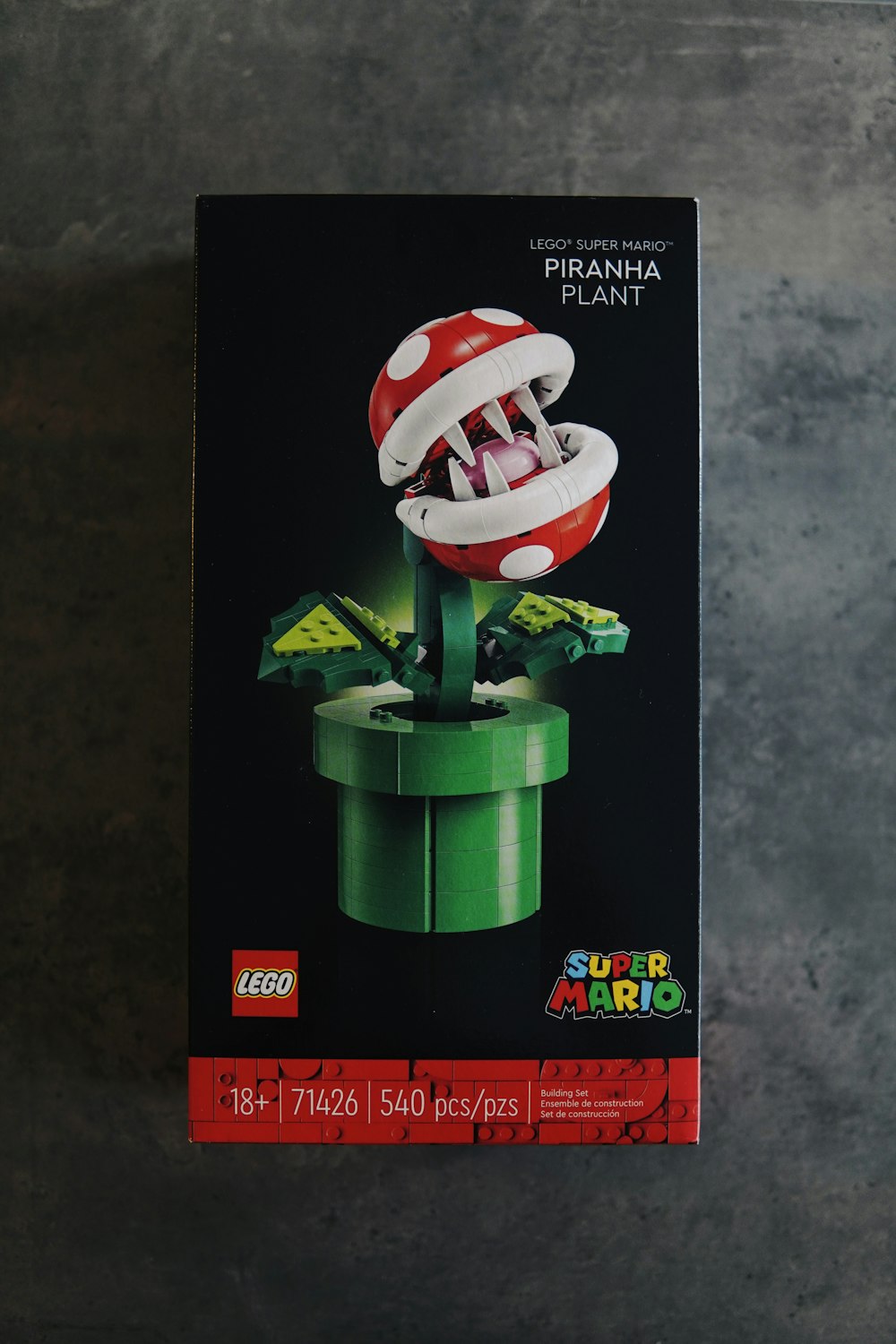 a box of legos with a mushroom on top of it