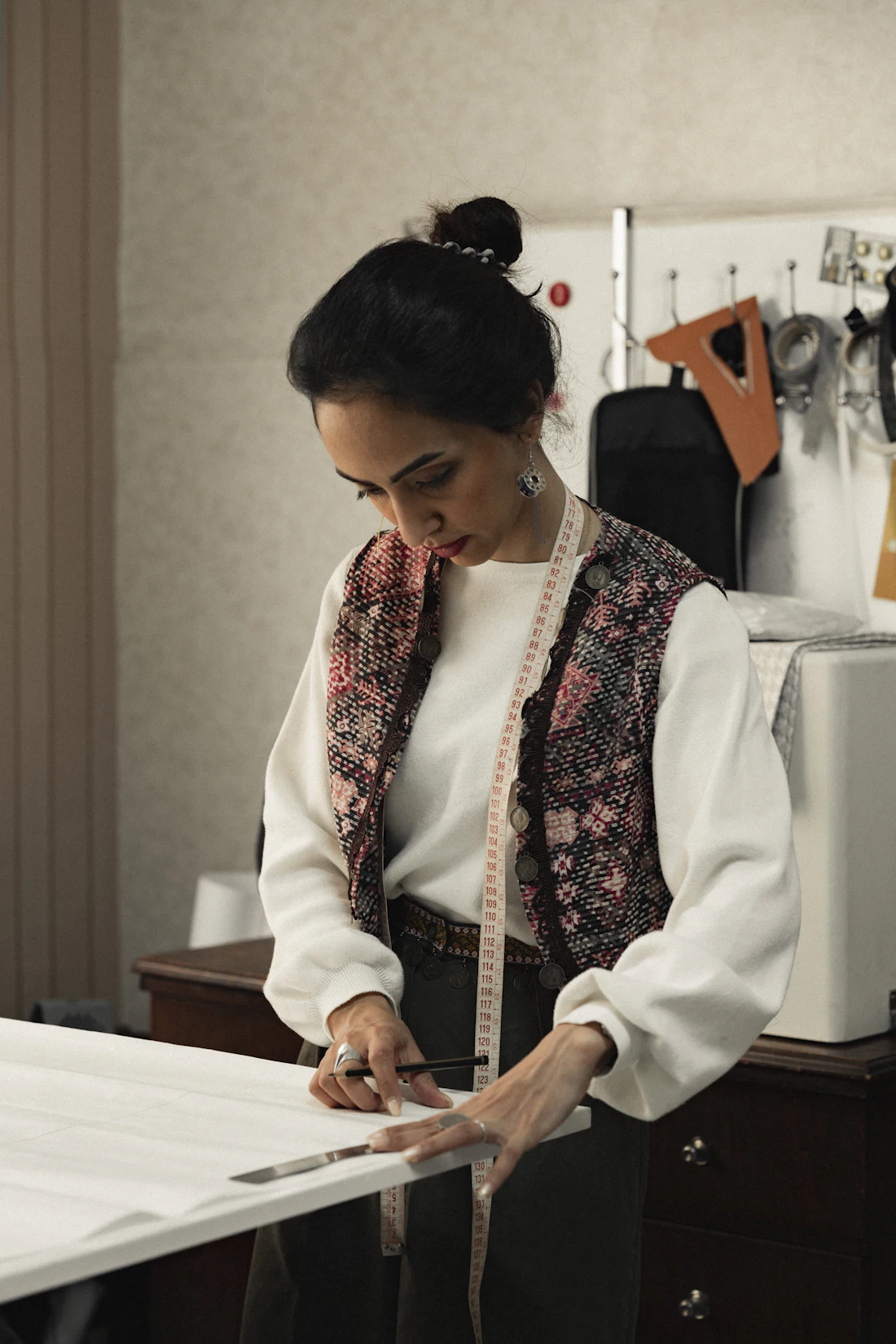 An inspector examining a length of fabric