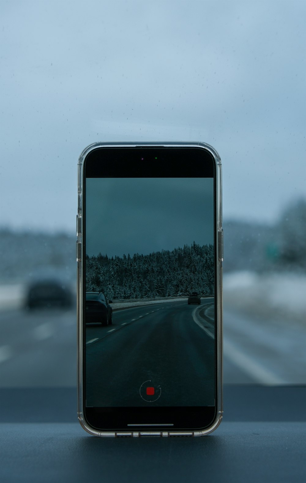 a cell phone sitting on the dashboard of a car