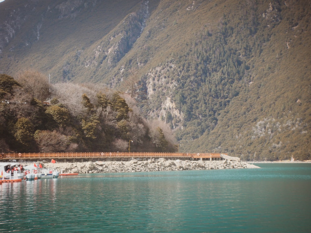 a body of water with a mountain in the background