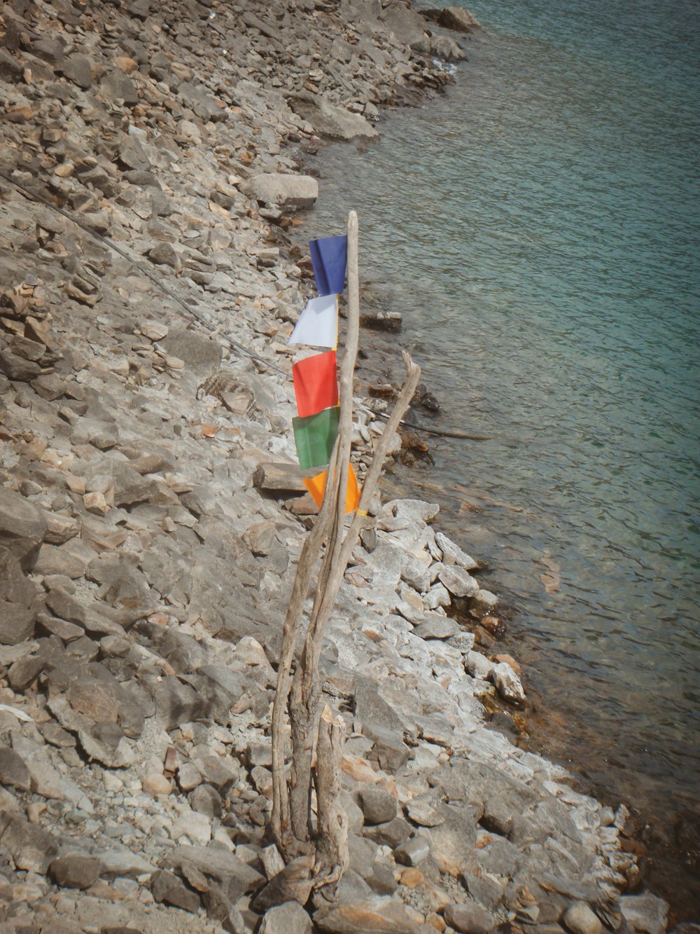 a boat is sitting on the shore of a lake