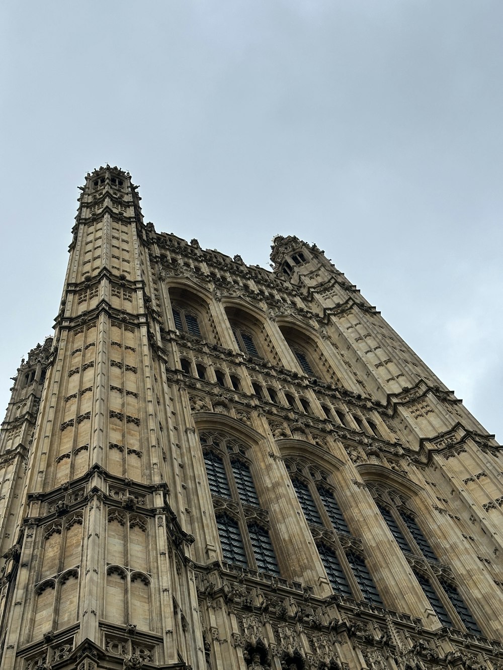 a very tall building with a clock on it's side