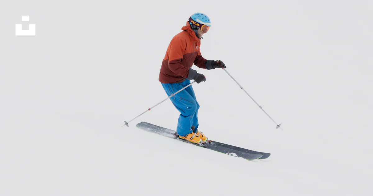 Ski Rider A man riding skis down a snow covered slope photo – Free Skiing Image ...