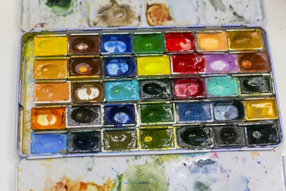 a close up of a paint palette on a table