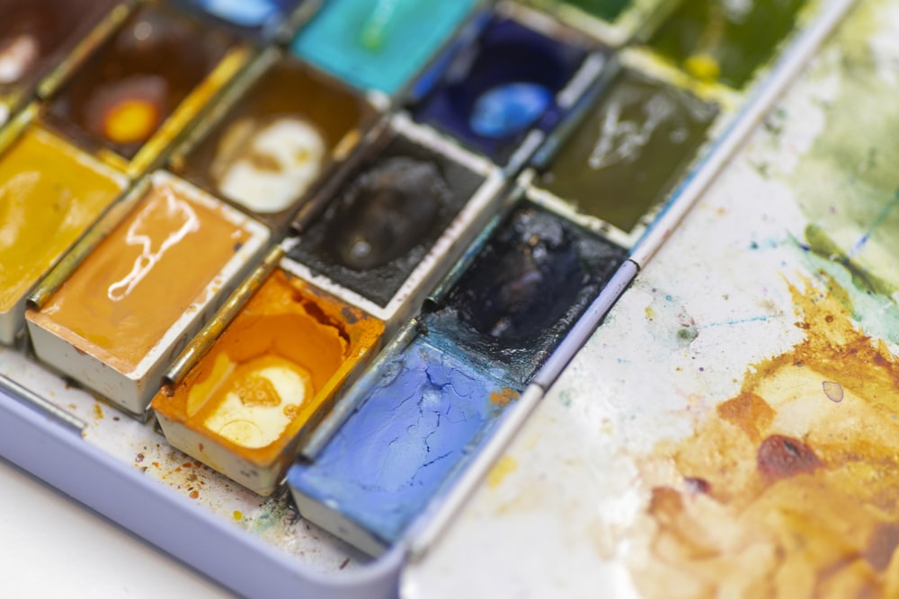 a close up of a paint palette with many colors