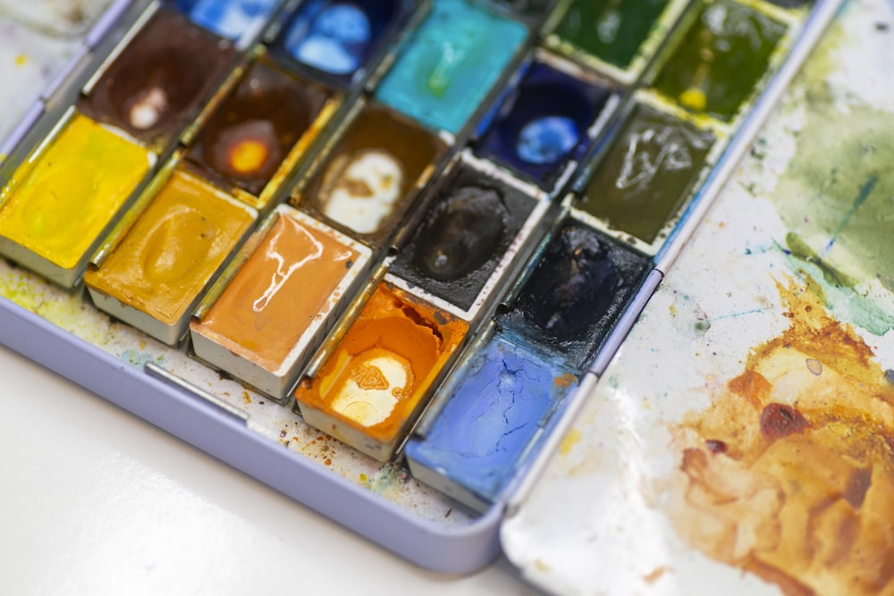 a close up of a paint palette on a table