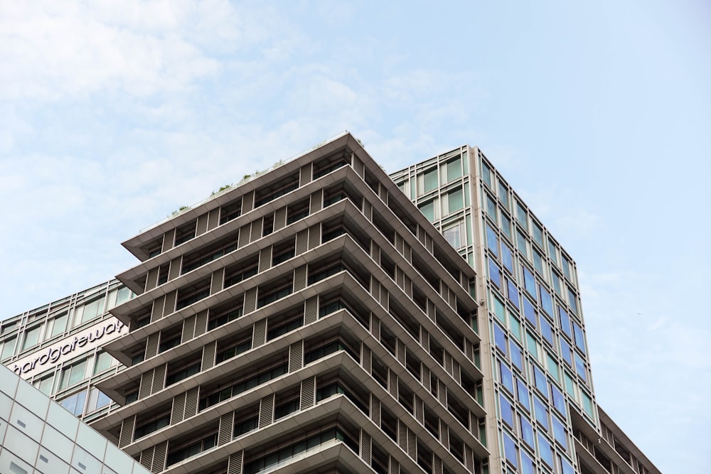 a very tall building sitting next to a very tall building