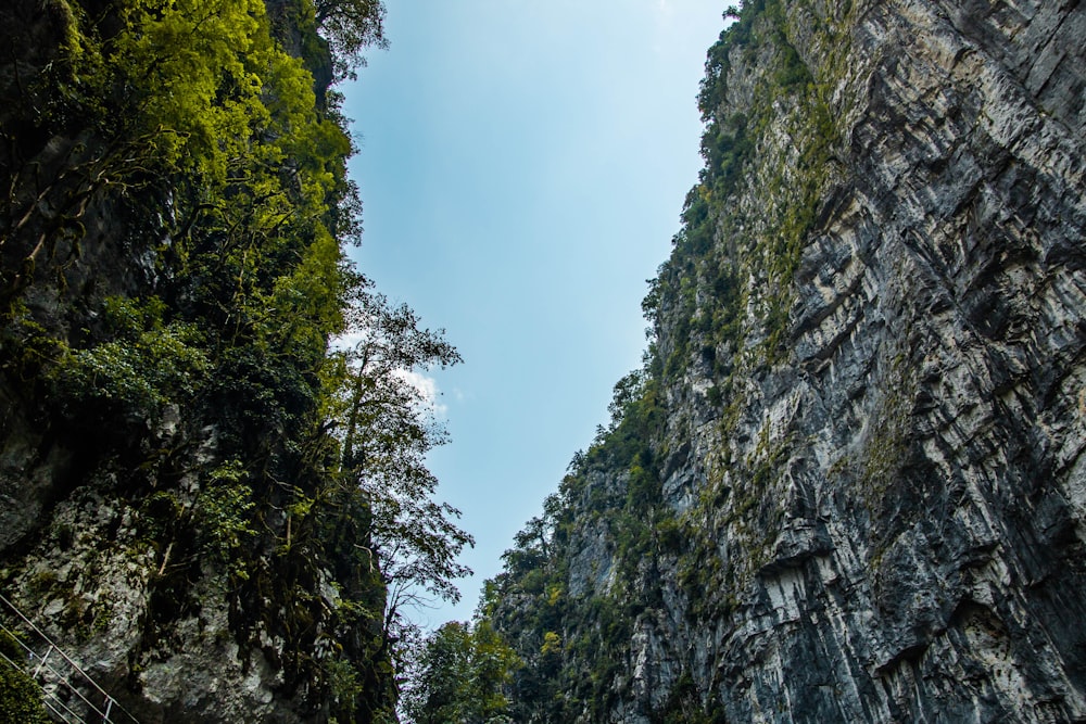 a view of a narrow road between two mountains