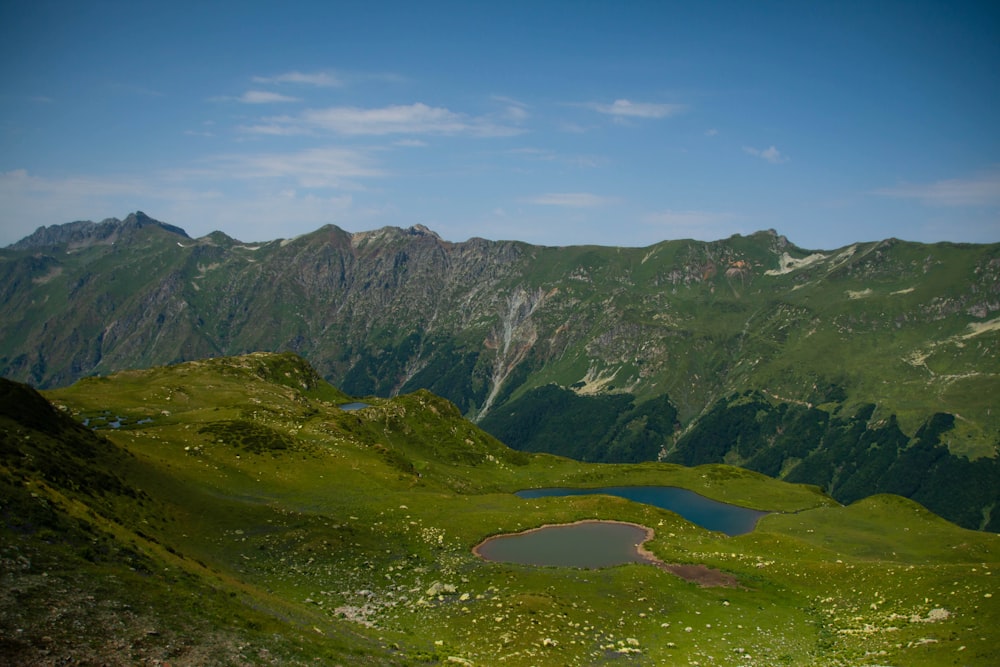 a mountain range with a lake in the middle of it