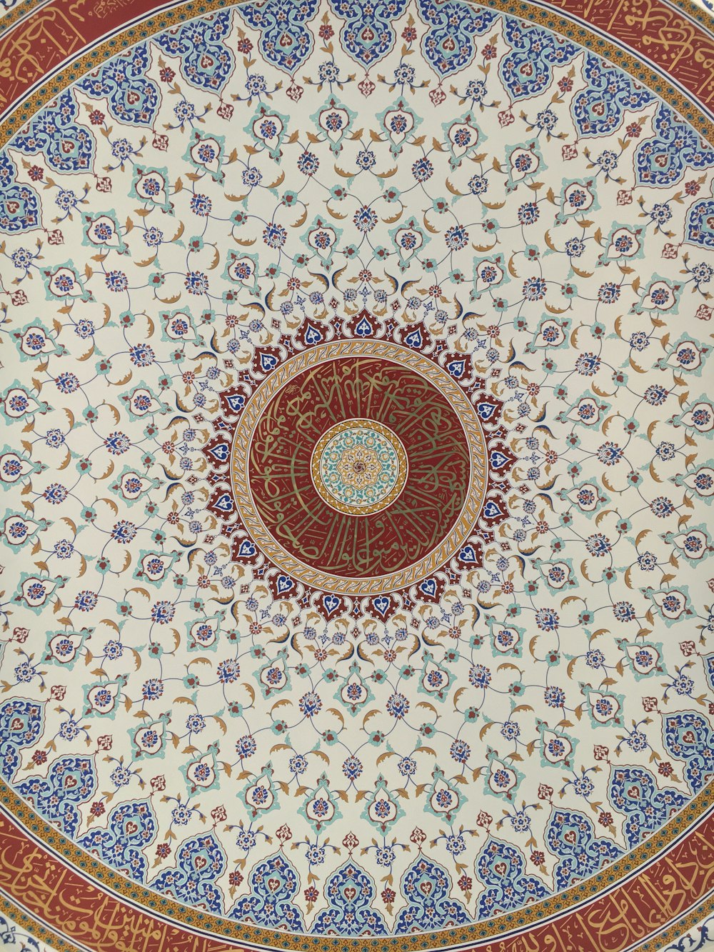 a decorative ceiling with a circular design on it