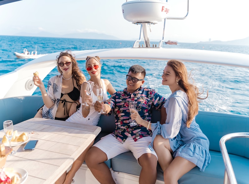 a group of people sitting at a table on a boat