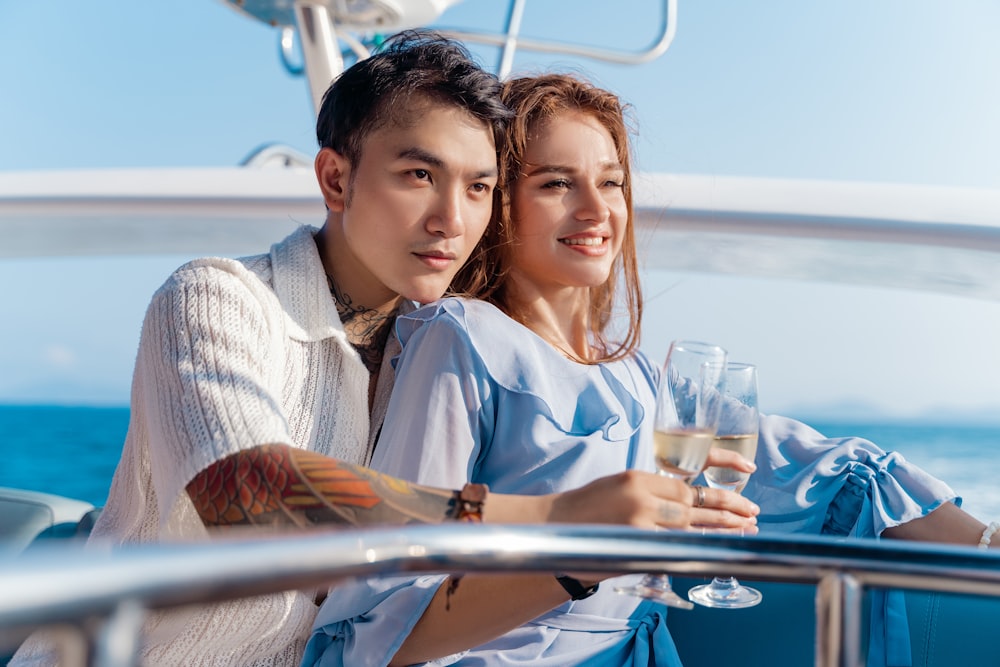 a man and a woman are sitting on a boat