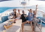 a group of people sitting on a boat