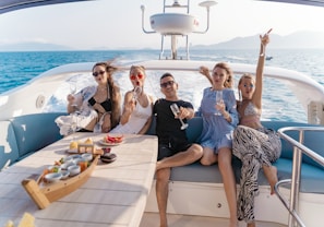 a group of people sitting on a boat
