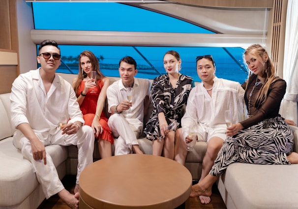 a group of people sitting on a couch next to each other