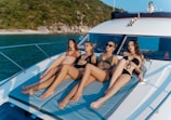 a group of women sitting on top of a boat