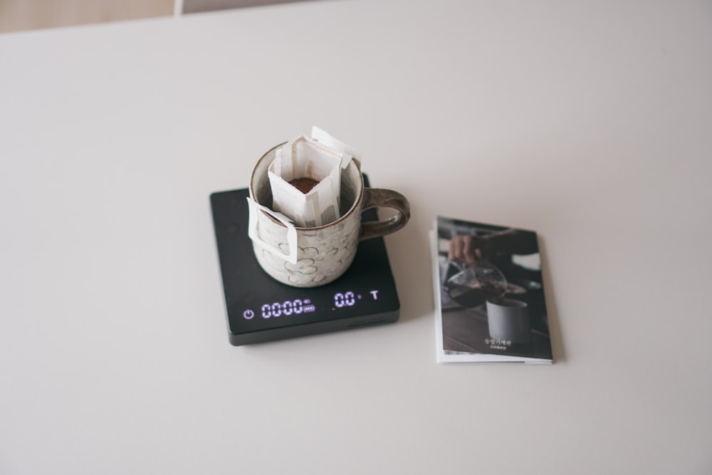 a coffee cup sitting on top of a coaster