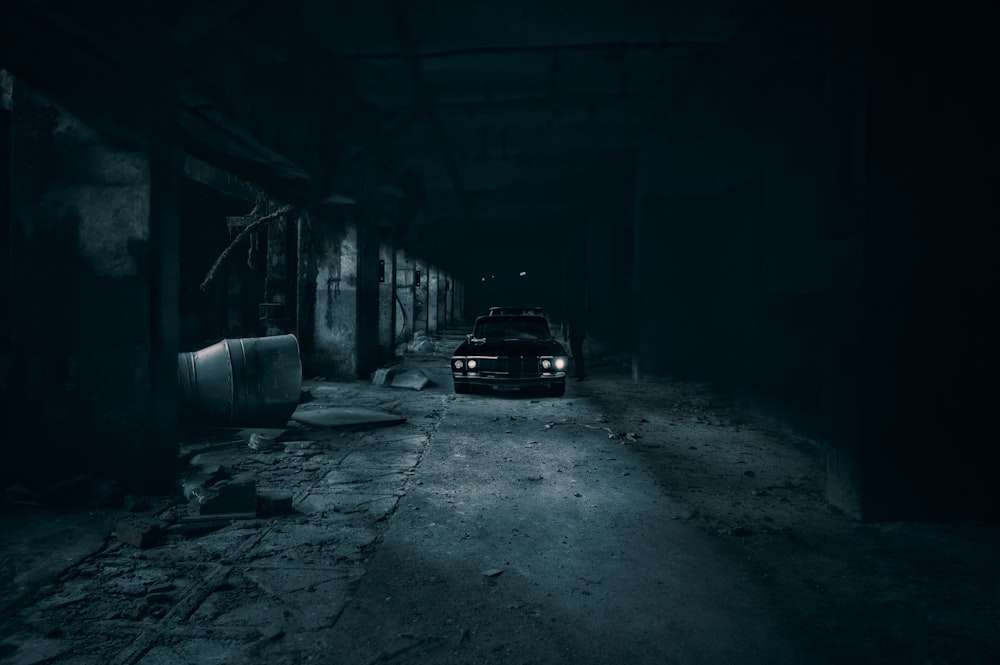 a car is parked in a dark alley