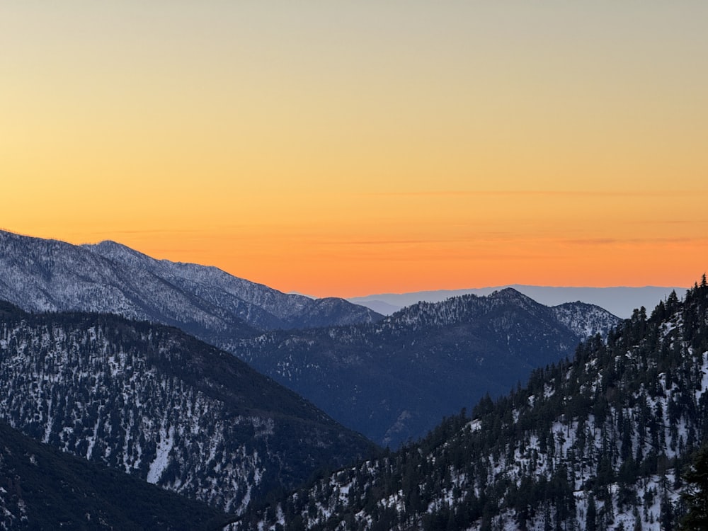 a view of a mountain range at sunset