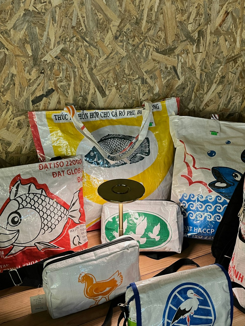 a pile of bags sitting on top of a wooden table