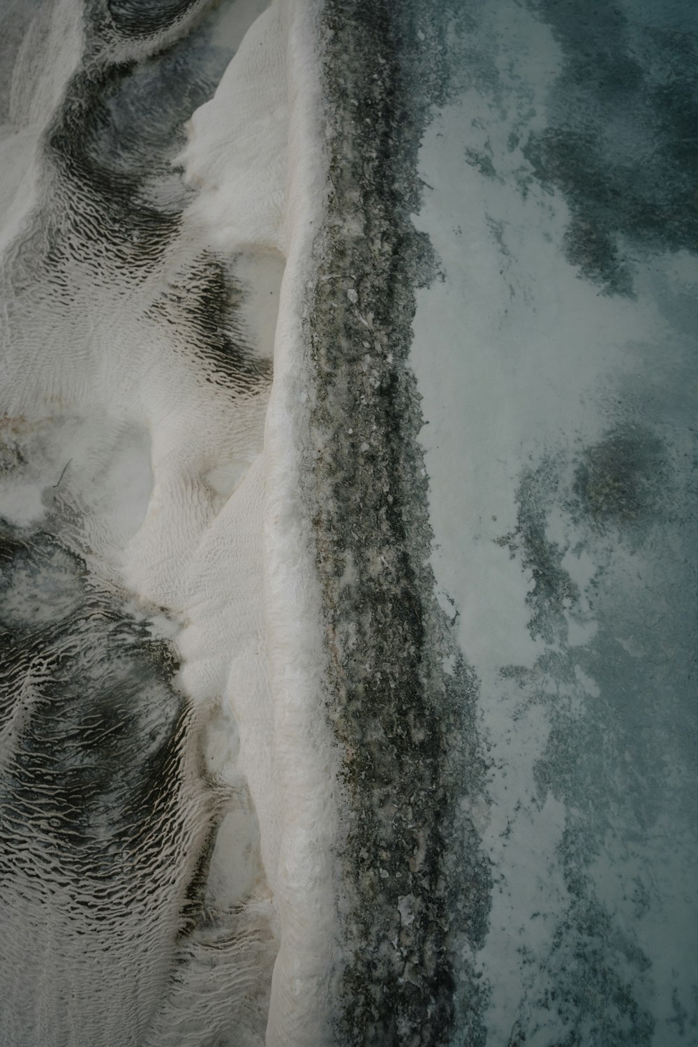 an aerial view of snow and ice on the ground