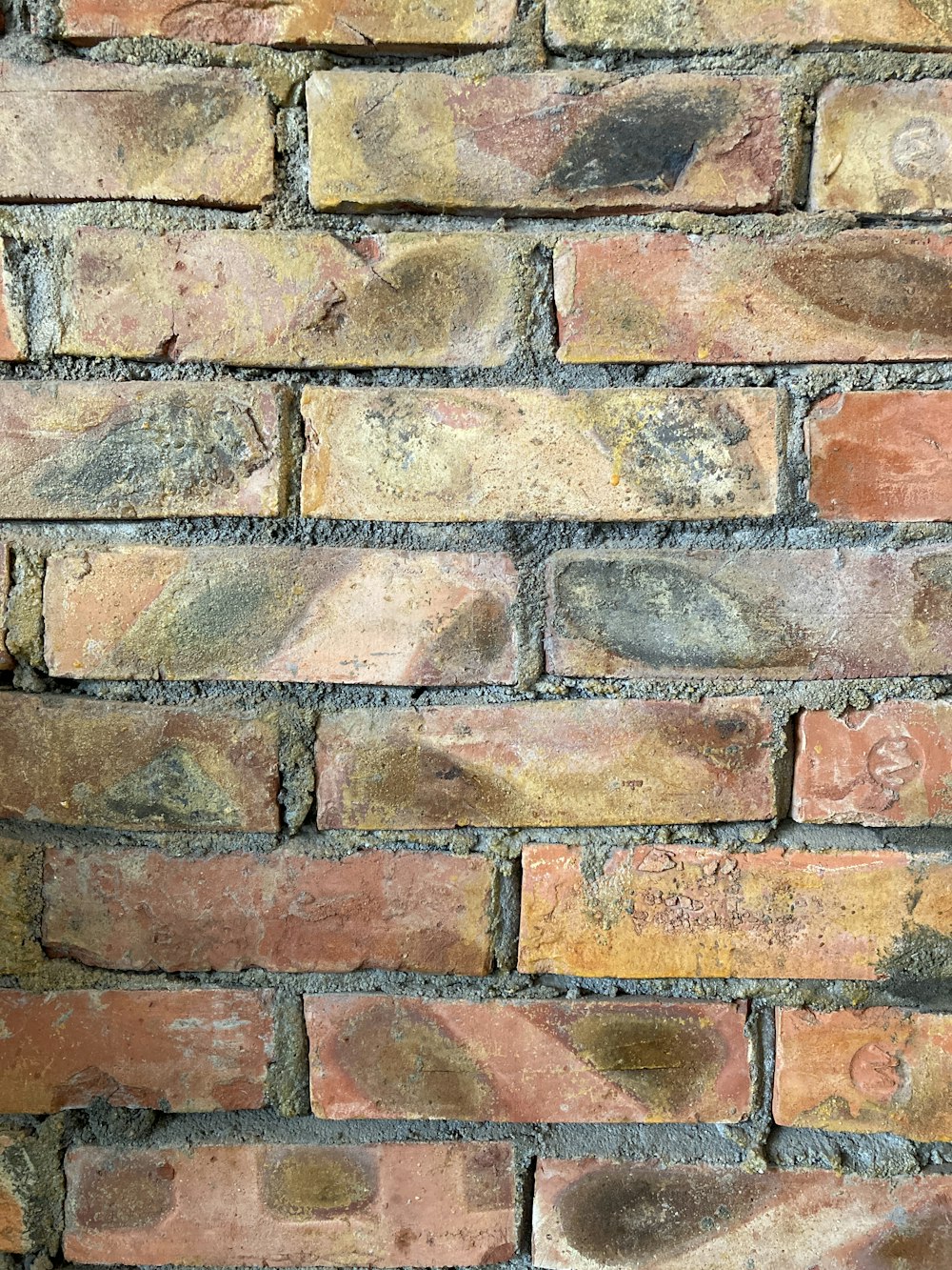 a close up of a brick wall made of bricks