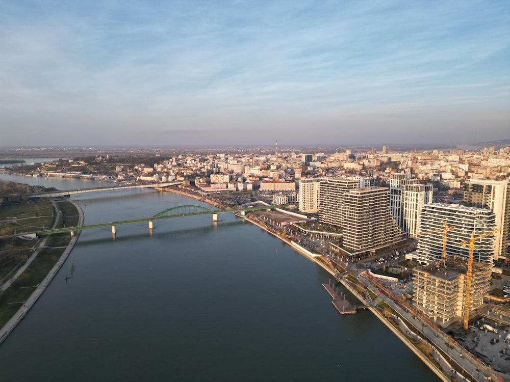 a river running through a city next to a bridge